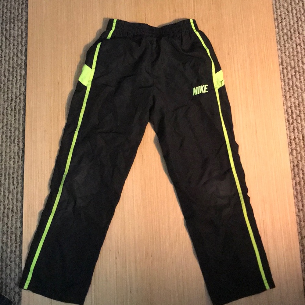 Black and neon green Nike track pants